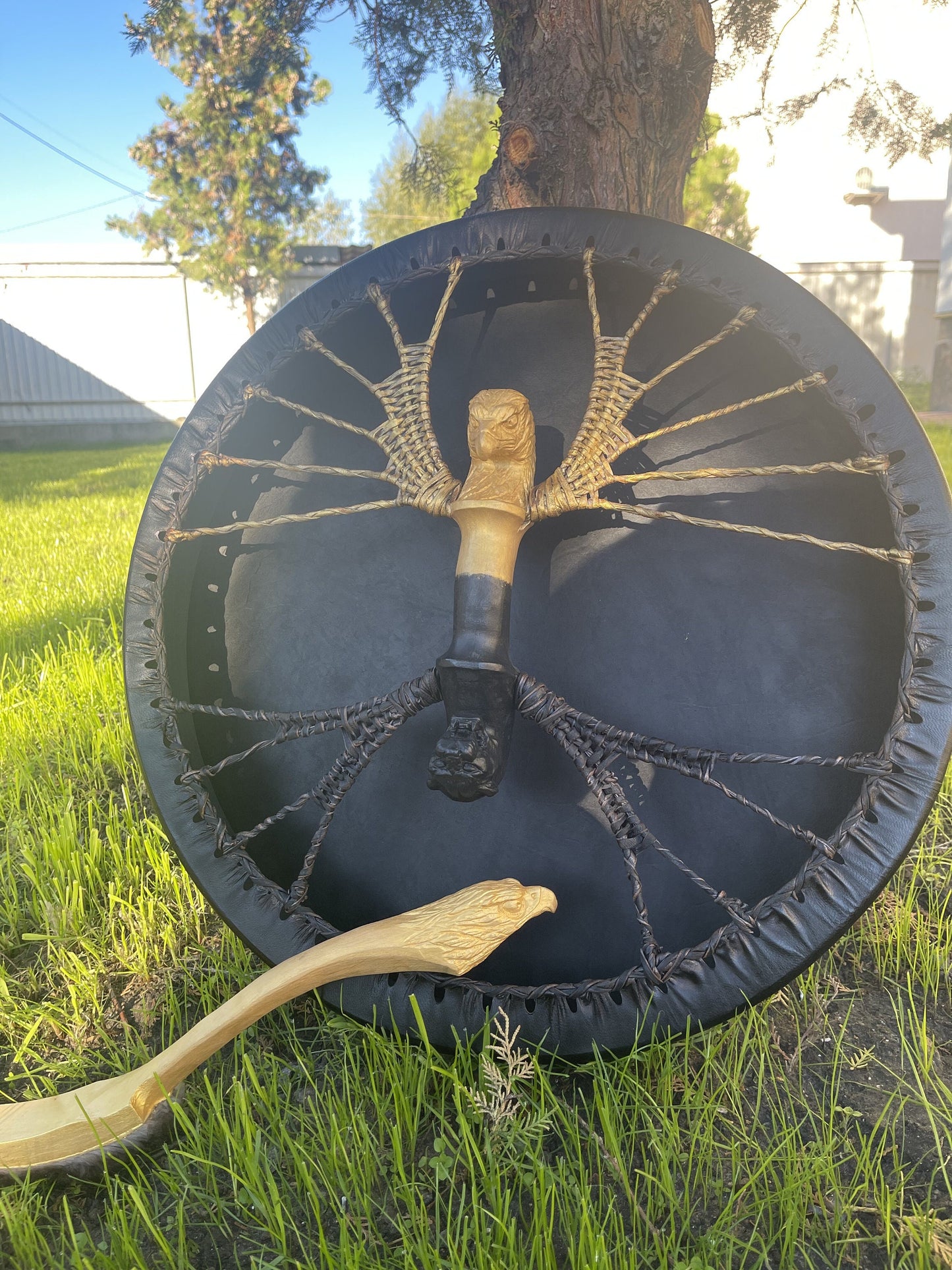 Shaman drum with gold cord lacing and eagle head handle