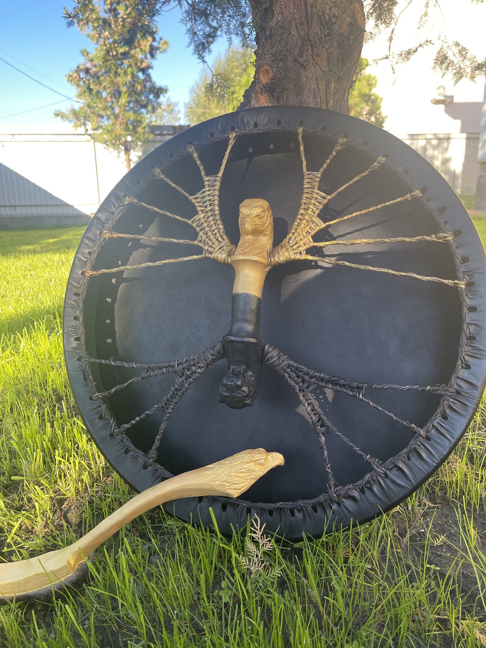 Shaman drum with gold cord lacing and eagle head handle