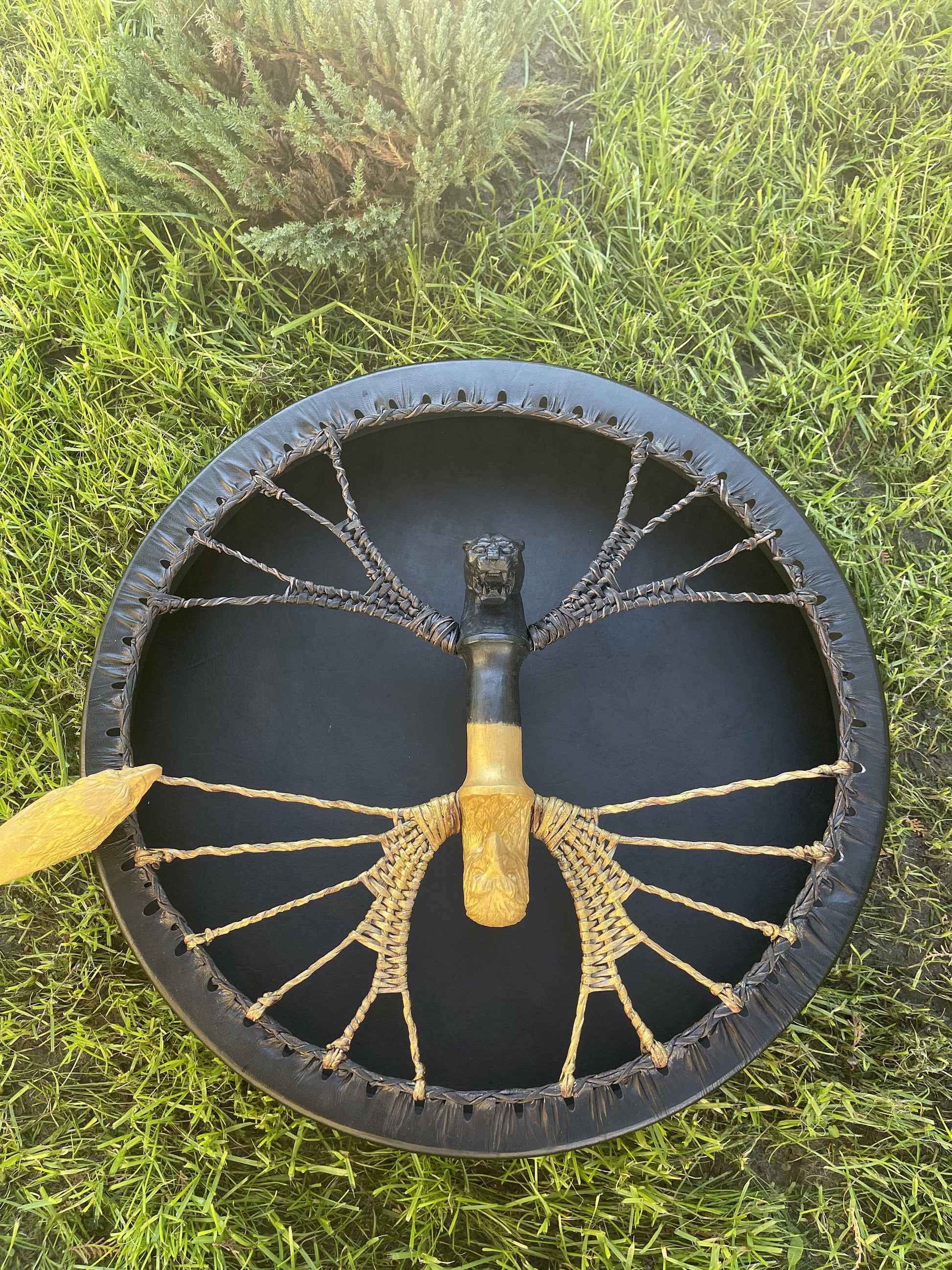 Black shamanic frame drum, carved animal head handle