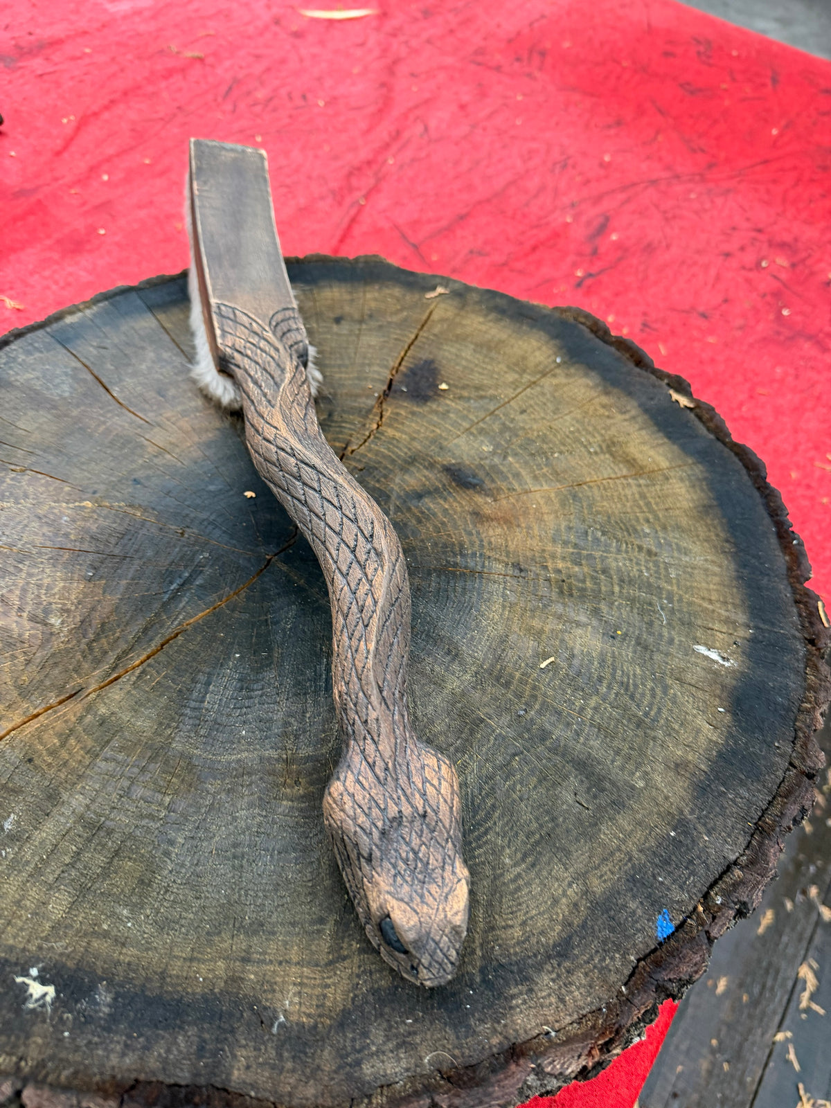 Snake drum beater from above
